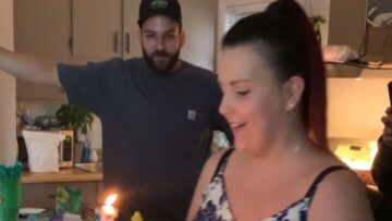 Adorable-Toddler-Embraces-His-First-Birthday-Cake-in-a-Sweet.jpg