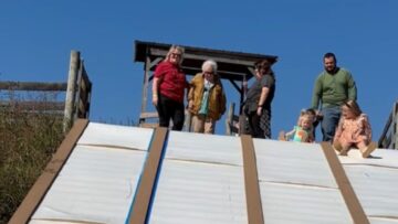 Grandma-and-Granddaughters-Joyful-Slide-Adventure-Sparks-Careful-Thrills.jpg