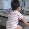Kitchen drawer adventure: Fearless foodie lad satisfies hunger! Cute |