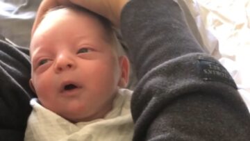 Sleepy-baby-beams-with-PURE-joy-as-mom-caresses-his.jpg