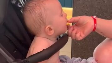 Squinty-eyed-little-boy-tries-lemon-for-the-first-time.jpg