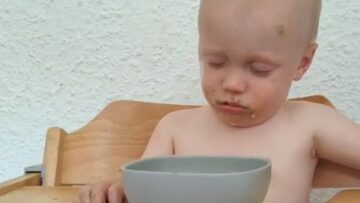 Comical-Toddler-Takes-Hilarious-Nap-on-Food-Bowl-Super.jpg