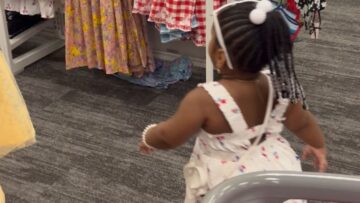 Young-girl-delighted-to-find-her-dress-twin-Brimming.jpg